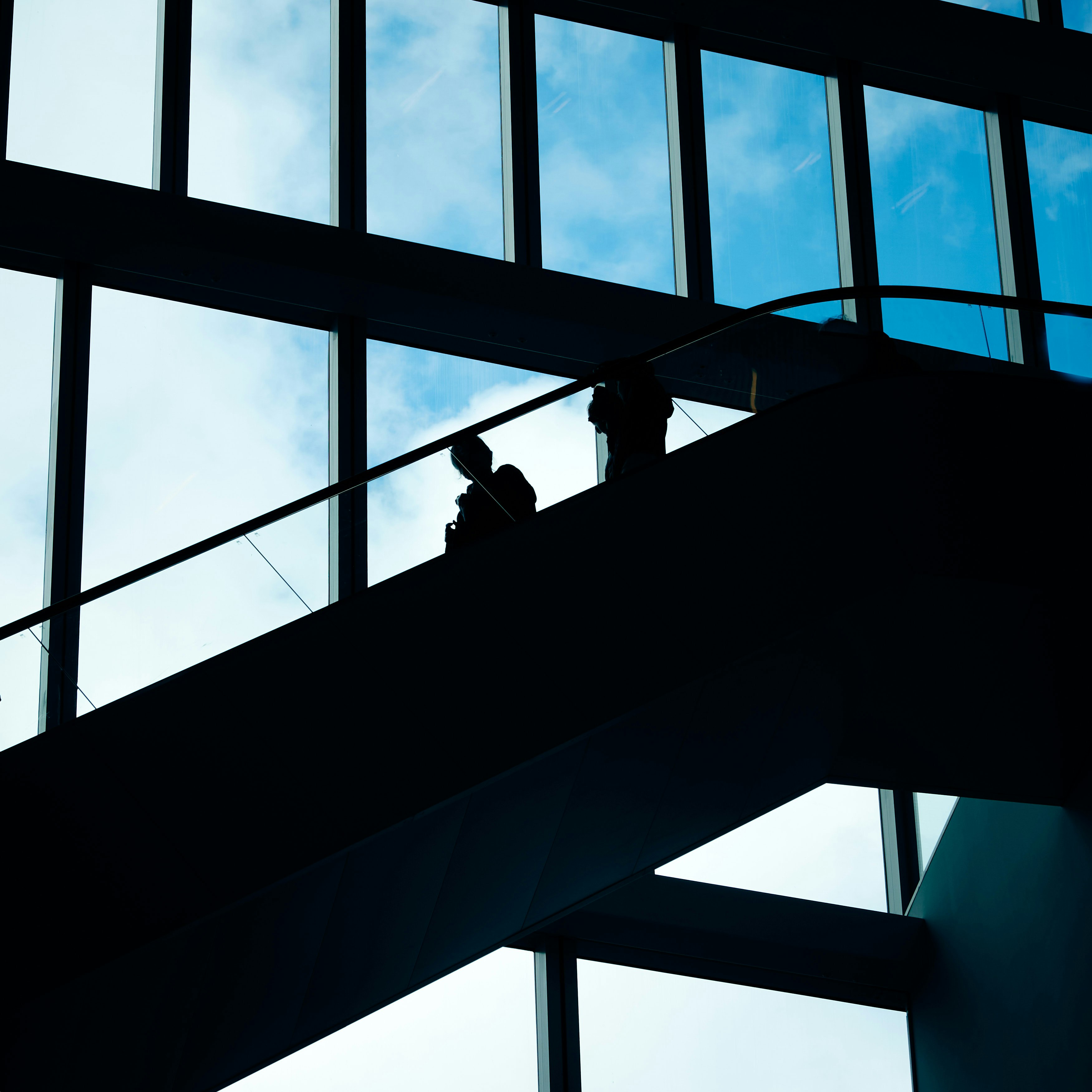 silhouette of people on a building